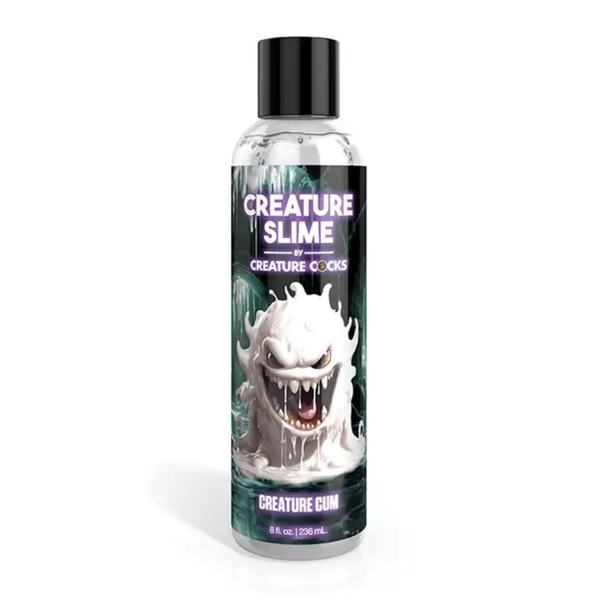 Front studio view of the 8 fl oz (236 ml) clear squeeze bottle of Creature Slime Creature Cum Unscented Jizz Lubricant, featuring a white slime monster illustration on a dark label with a black cap.