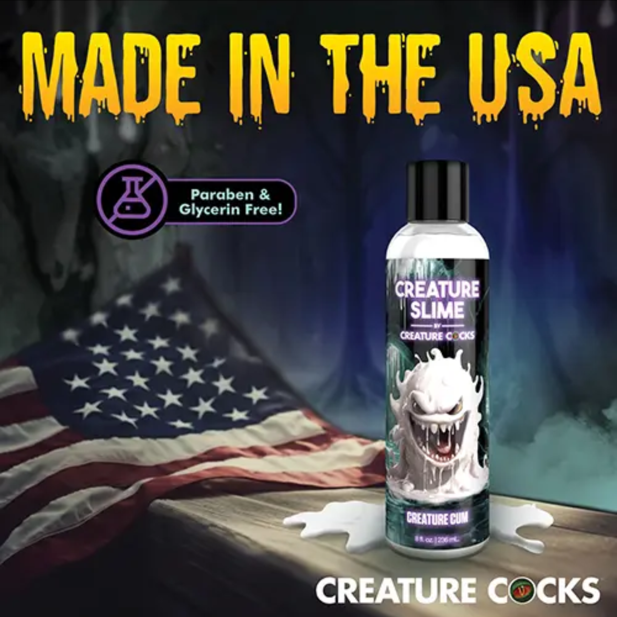 Marketing banner titled "Made in the USA" displaying the 8 fl oz bottle of Creature Cum Lubricant standing on a wooden surface next to an American flag, featuring a badge for "Paraben & Glycerin Free!"