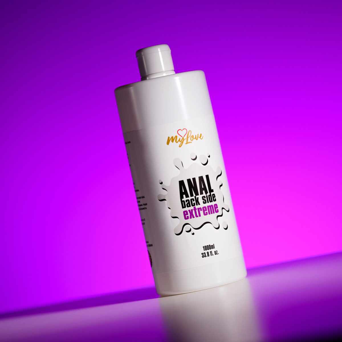 Front view of the large 1000 ml MyLove Anal Back Side Extreme bottle set against a solid purple backlit backdrop.