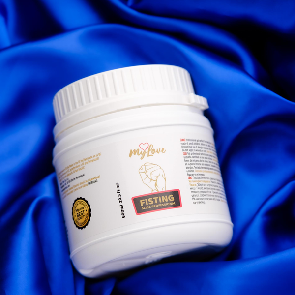 The 600 ml tub of MyLove Fisting Slide Professional gel rests at an angle on rich, draped royal blue satin fabric.