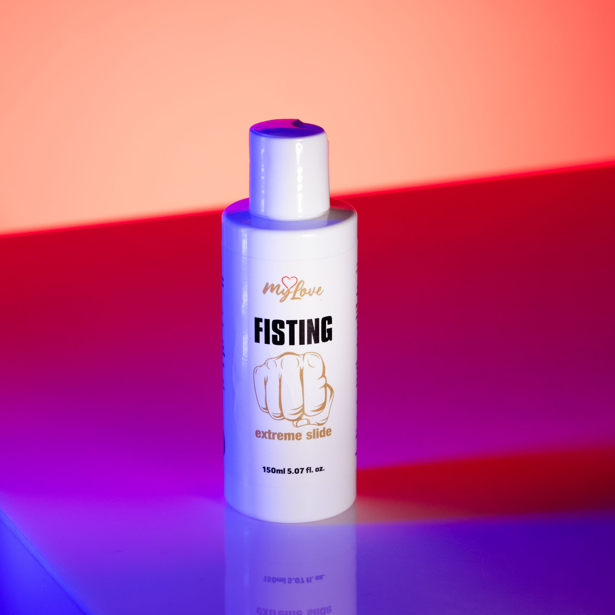 Front view of the 150 ml MyLove Fisting Extreme Slide gel bottle standing under vibrant pink and blue dual-tone lighting. The white bottle features a gold fist illustration on the front label.