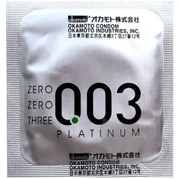 Close-up of a silver foil condom wrapper featuring the "Okamoto 003 Platinum" logo and Japanese manufacturing details.