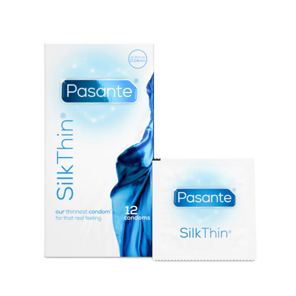 A Pasante Silk Thin condom box and a single condom wrapper. The box is white and light blue. The box contains 12 condoms. To the right of the box is a single white condom wrapper with the same Pasante Silk Thin design