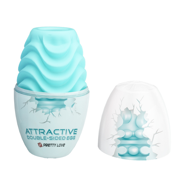 Open packaging shot displaying the top cap of the egg-shaped shell removed to reveal the light blue masturbation sleeve resting inside the base.