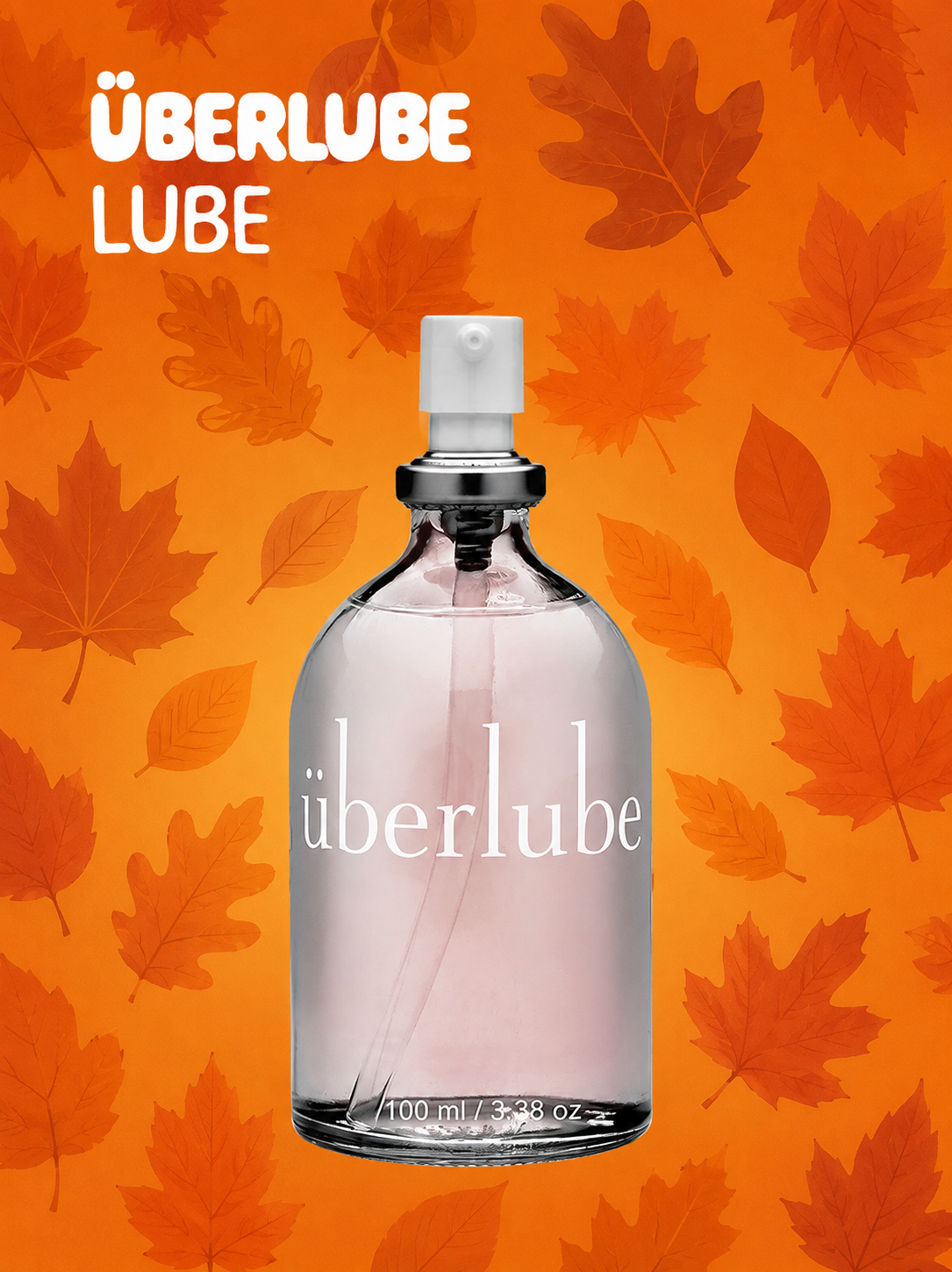 A clear glass perfume bottle labeled "öberlube" with a white spray top, centered on an orange background patterned with overlapping autumn leaves. The words "ÜBERLUBE LUBE" appear in white at the top left.
