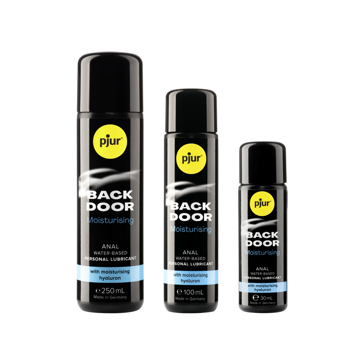 Three black bottles of pjur BACK DOOR Moisturising anal water-based personal lubricant in different sizes (250ml, 100ml, and 30ml) are arranged in a row from largest to smallest against a white background. Each bottle has a yellow pjur logo and teal accents. Imagen principal del producto