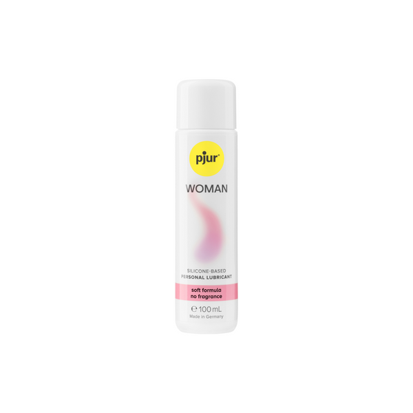 A white bottle of Pjur Woman silicone-based personal lubricant 100ml with a yellow logo and pink label indicating "soft formula no fragrance".